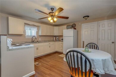 THIS VIEW OF THE EAT-IN KITCHEN SHOWS THE LOVELY F