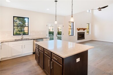 Kitchen featuring sink, a kitchen island, decorati