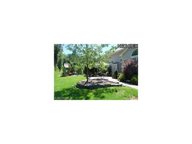 View of rear patio and landscaping