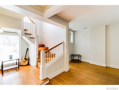 Attractive living room and stairway. Love the LIGHT!