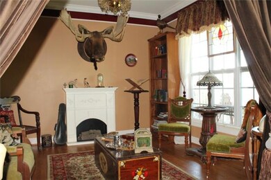 Velvet curtains line the entry into your living room with big picture window