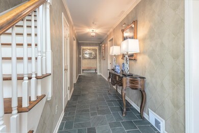 Welcoming and Artfully Elegant Entry Hall designed