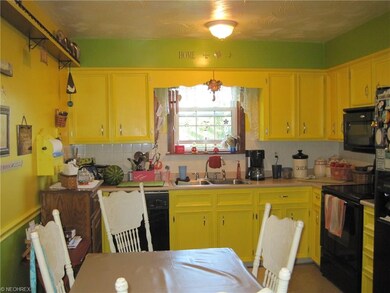 Appliances remain in the eat in kitchen