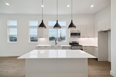 Spacious kitchen with modern fixtures, sleek cabin