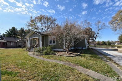 View of front of house with a front yard