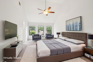 Bedroom featuring high vaulted ceiling, carpet fl