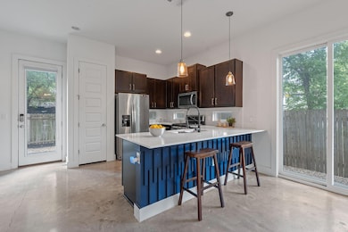 Kitchen featuring stainless steel appliances, fin