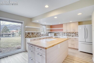 Kitchen backsplash, new LVP floors, butcher block 