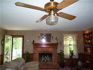 Spacious Family Room with Fireplace and Built-In.  French Door to Deck for Expanded Entertaining