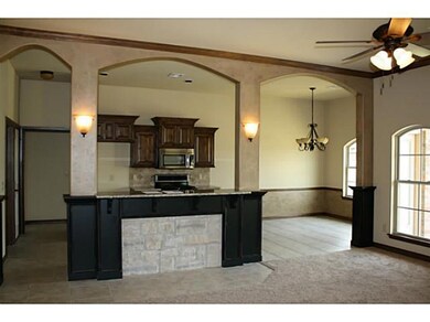 Living Room. 3 arches open the living to the kitch