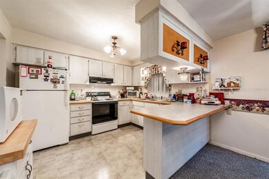 The kitchen is well equipped and offers room to move around, solid surface counters, a BREAKFAST BAR and ample cabinet space!