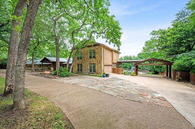 View of front of house with a carport