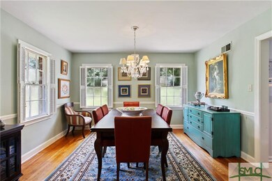 Dining room easily suits dinner for six, but with 
