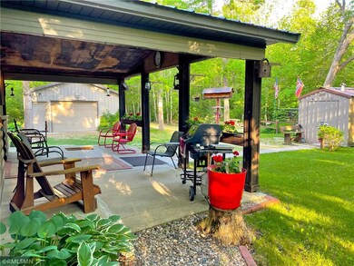 View of the spacious covered front porch, the cabi