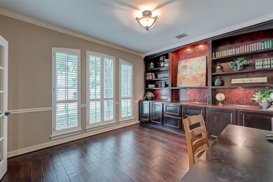 The Study with Built in Shelving, Hardwood Floors, Recent paint, and plantation shutters