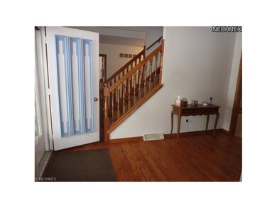 Large Hardwood Foyer Entry with Guest Closet, Double Door Entry.