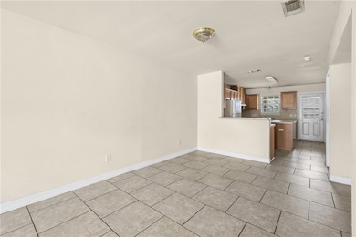 Unfurnished living room with light tile patterned