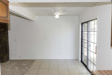 Eating space in kitchen with slider to patio.