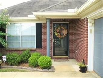 Inviting entry with covered front porch.