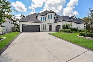 Double wide driveway and 3 attached garages.