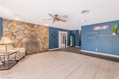 Living room looking back on entryway and doorway t