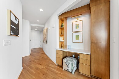This photo showcases a modern hallway with  built-
