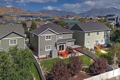View of front of property with a residential view, a fenced backyard, and a mountain view