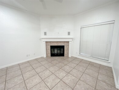 Step into a bright and inviting living space featuring fully tiled flooring for a sleek, low-maintenance finish.