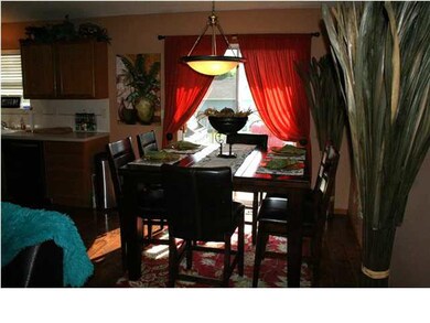 Dining Room with sliding glass doors to the wood d