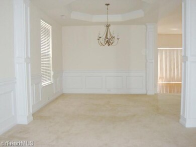 Living Room. Living Room looking into the Dining Room, note the columns and all the wonderful trim wood..see how open it is you can also see into the breakfast area