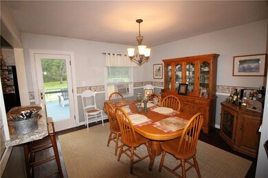 Formal dining room with full glass door that leads