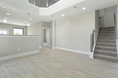 Unfurnished living room featuring recessed lighti