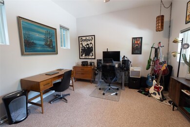 Carpeted office with plenty of natural light