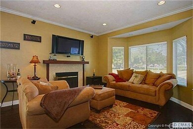 Living room is wired with surround sound speakers
