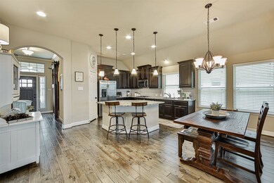 A spacious Kitchen provides a great place for family and friends to gather.
Large Kitchen Island, Large Breakfast area and a Wall of Windows providing natural lighting and a great space for Dining and Entertaining.