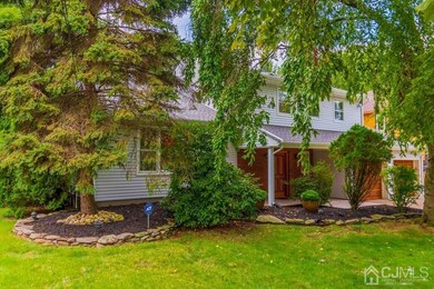 FRONT SIDE VIEW OF LOVELY LANDSCAPED PROPERTY
