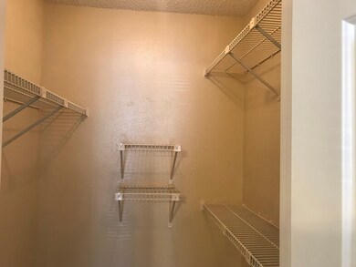 Walk in closet for the primary bedroom.