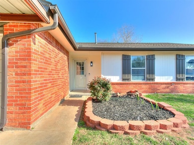 View of exterior entry featuring brick siding