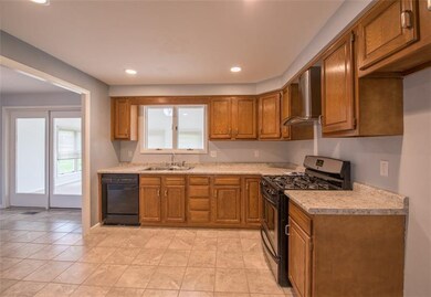 Open kitchen floor plan with new stove, flooring a