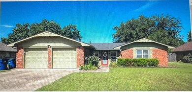 Single story home featuring a garage and a front l