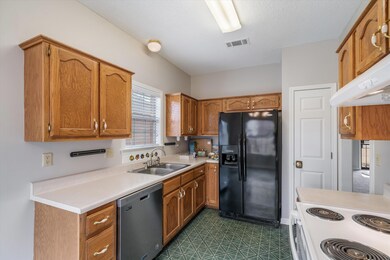 Kitchen featuring sink, stainless steel dishwasher