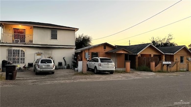 View of front facade featuring a balcony and a residential view