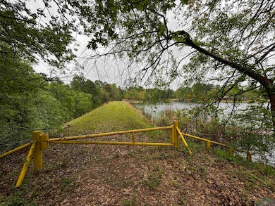 View of gate featuring a water view and a view of 
