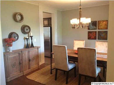 Formal dining with a tongue and groove ceiling makes for a friendly dinner.