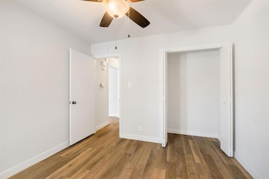 Unfurnished bedroom featuring wood finished floor