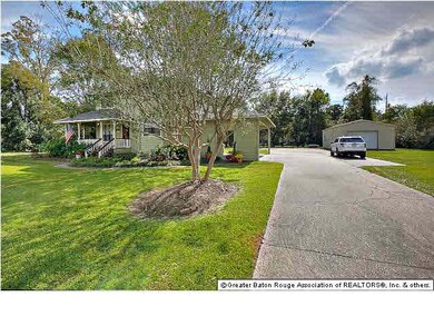 View 2 showcases the driveway with ample parking, 