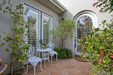 Beautiful Courtyard Entry With Custom Glass Front 