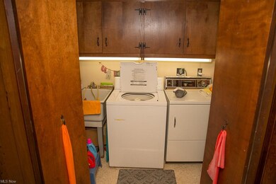 Laundry tucked into the family room behind bifold 