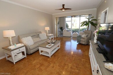 Living room featuring ceiling fan and ornamental m