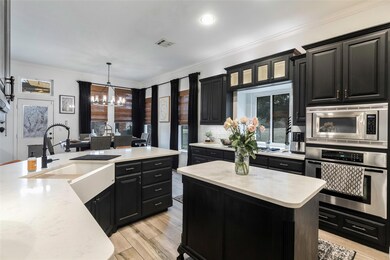 Kitchen with decorative light fixtures, stainless 